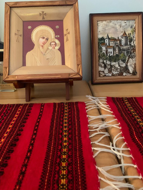 On my bureau here in Alaska sits an icon image made by a local craftsman, all of small pieces of wood. Next to it is a picture made of birch. The two wool weavings are also from Ukraine.